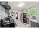 Efficient kitchen layout with gray cabinets and modern appliances, perfect for cooking at 1324 Almont Sw Dr, Atlanta, GA 30310
