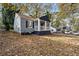 Cozy cottage-style house with freshly painted blue trim and ample yard space at 1417 Graymont Sw Dr, Atlanta, GA 30310