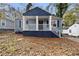 Charming blue home with a covered front porch and freshly painted blue trim at 1417 Graymont Sw Dr, Atlanta, GA 30310