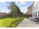 Grassy backyard featuring outdoor seating, a playset, and a fenced perimeter at 1742 Weatherbrook Cir, Lawrenceville, GA 30043