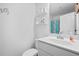 Bright white bathroom with a large sink, neutral accents, and shelves for toiletries at 1742 Weatherbrook Cir, Lawrenceville, GA 30043