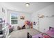room features a window, a small closet, and a single bed with colorful bedding at 1742 Weatherbrook Cir, Lawrenceville, GA 30043