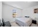 Cozy bedroom with window providing natural light, neutral tones, and simple decor at 1742 Weatherbrook Cir, Lawrenceville, GA 30043
