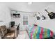 Bedroom with guitar decor, a study desk, and a comfortable chair at 1742 Weatherbrook Cir, Lawrenceville, GA 30043