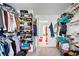Spacious walk-in closet features ample storage and organization for clothes, shoes, and accessories at 1742 Weatherbrook Cir, Lawrenceville, GA 30043