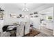 Elegant dining room with modern decor, featuring a stylish table and decorative shelves for storage at 1742 Weatherbrook Cir, Lawrenceville, GA 30043