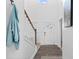 Bright entryway with coat rack and soaring ceilings, showcasing hardwood floors and modern design at 1742 Weatherbrook Cir, Lawrenceville, GA 30043