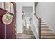 Bright foyer with hardwood floors, a staircase, and a welcoming entrance into the home at 1742 Weatherbrook Cir, Lawrenceville, GA 30043