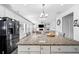 Kitchen island featuring granite countertops and seating, perfect for entertaining at 1742 Weatherbrook Cir, Lawrenceville, GA 30043