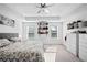 Inviting main bedroom featuring neutral walls and carpet flooring, tray ceilings, and lots of storage at 1742 Weatherbrook Cir, Lawrenceville, GA 30043