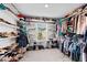 Expansive walk-in closet features built-in shelving and ample hanging space for clothing and accessories at 1742 Weatherbrook Cir, Lawrenceville, GA 30043