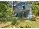 Backyard of home featuring a pathway and ample lawn space at 3530 Fairlane Nw Dr, Atlanta, GA 30331