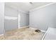 Basement space in need of updating with flooring and grey-painted walls at 3530 Fairlane Nw Dr, Atlanta, GA 30331