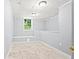 Bright basement room with a window and natural light at 3530 Fairlane Nw Dr, Atlanta, GA 30331