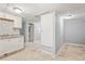 Basement kitchenette featuring white cabinets and gray walls at 3530 Fairlane Nw Dr, Atlanta, GA 30331