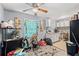 A compact kitchen with white cabinets, grey walls, and standard appliances at 3530 Fairlane Nw Dr, Atlanta, GA 30331