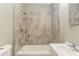 Bathroom featuring a tiled shower/tub combination and a stylish vanity at 1116 Northwest Nw Dr, Atlanta, GA 30318