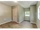 Cozy bedroom with wood-look flooring, a closet, and a window for natural light at 1116 Northwest Nw Dr, Atlanta, GA 30318