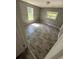 Bright bedroom with wood-look flooring and two windows providing ample natural light at 4402 Highland Rd, Decatur, GA 30035