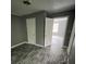 Spacious bedroom with wood-look flooring and easy access to adjacent rooms at 4402 Highland Rd, Decatur, GA 30035