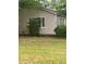 Charming home with light siding, neat landscaping, and a well-maintained front yard at 4402 Highland Rd, Decatur, GA 30035