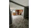 Modern kitchen features wood cabinets, white appliances, and sleek wood-look flooring at 4402 Highland Rd, Decatur, GA 30035