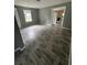 Open-concept living room boasts wood-look flooring, natural light, and modern neutral colors at 4402 Highland Rd, Decatur, GA 30035