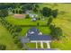 Gorgeous aerial view showing the house and the greenery surrounding the property at 500 Coleman Mill Rd, Carrollton, GA 30116