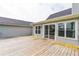 Wooden back deck with sliding glass doors, seamlessly blending indoor and outdoor living at 500 Coleman Mill Rd, Carrollton, GA 30116