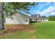 Expansive backyard featuring a well-maintained lawn, deck, and access to the home at 500 Coleman Mill Rd, Carrollton, GA 30116