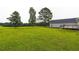 Expansive backyard with lush lawn and mature trees, perfect for outdoor activities at 500 Coleman Mill Rd, Carrollton, GA 30116