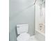 Minimalist bathroom showcasing a white toilet, bathtub, and a simple shower area at 500 Coleman Mill Rd, Carrollton, GA 30116