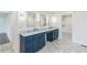 Stylish bathroom with dual marble-top vanities, sleek mirrors, and dark blue cabinets at 500 Coleman Mill Rd, Carrollton, GA 30116