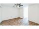 Bright bedroom featuring wood-look flooring and ceiling fan at 500 Coleman Mill Rd, Carrollton, GA 30116
