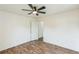 Bright bedroom featuring wood-look flooring, ceiling fan and white trim at 500 Coleman Mill Rd, Carrollton, GA 30116