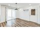 Bright dining area with sliding glass doors, wood floors, and modern lighting at 500 Coleman Mill Rd, Carrollton, GA 30116