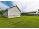 Side of the exterior of the house with a large green grass yard and metal shed on the property at 500 Coleman Mill Rd, Carrollton, GA 30116