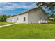 Detached garage with a roll-up door and additional access doors, plus space for outdoor activities at 500 Coleman Mill Rd, Carrollton, GA 30116