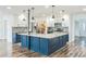 Open kitchen with a large center island, white cabinets, stainless appliances, and spacious pantry at 500 Coleman Mill Rd, Carrollton, GA 30116