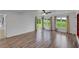 Sun-filled living room with hardwood floors, bright windows, and charming, colorful curtains at 500 Coleman Mill Rd, Carrollton, GA 30116