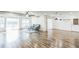 Spacious living room with wood floors, large windows, and access to the dining area at 500 Coleman Mill Rd, Carrollton, GA 30116