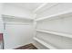 Bright pantry with white walls, wooden floors, and built-in shelves for optimal storage at 500 Coleman Mill Rd, Carrollton, GA 30116