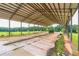 Large metal shed with a concrete floor, perfect for storing equipment or vehicles, adds practical value to the property at 500 Coleman Mill Rd, Carrollton, GA 30116