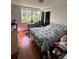 Bedroom with a large window, hardwood floors, and ample closet space at 2479 Peachtree Road Northeast Ne Rd # 402, Atlanta, GA 30305