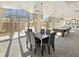 Spacious common room with dining area, pool table, and large windows offering bright, natural light at 2479 Peachtree Road Northeast Ne Rd # 402, Atlanta, GA 30305