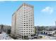 High-rise multi-Gathering apartment building against a bright sky and tree-lined streets at 2479 Peachtree Road Northeast Ne Rd # 402, Atlanta, GA 30305