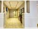 Well-lit hallway with neutral tones, classic architectural pillars, and elegant decor at 2479 Peachtree Road Northeast Ne Rd # 402, Atlanta, GA 30305