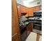 Kitchen with stainless steel appliances, wood cabinets and modern fixtures at 2479 Peachtree Road Northeast Ne Rd # 402, Atlanta, GA 30305
