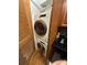 Stacked Washer and Dryer Laundry closet with custom cabinets at 2479 Peachtree Road Northeast Ne Rd # 402, Atlanta, GA 30305