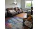 Living room with comfortable seating and a colorful rug at 2479 Peachtree Road Northeast Ne Rd # 402, Atlanta, GA 30305